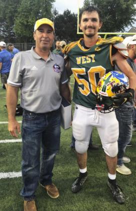 Wade Edis with Mullen’s Bryce McIntosh who played in the Sertoma Eight-Man All-Star Game on Saturday and was named the West’s MVP Defensive Player. The East defeated the West 40-29.