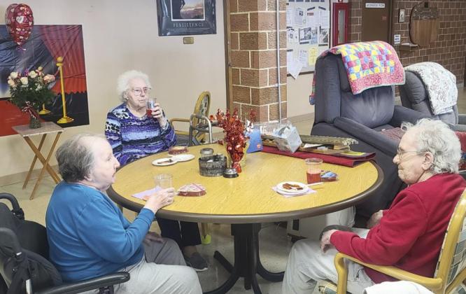 Peggy Barndt, Minnie Mary Hamilton and Virginia Wright enjoying the Valentine’s Day party.