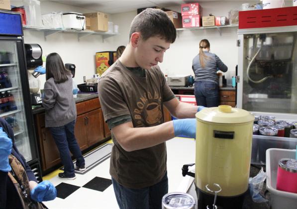 Kathy Leibhart, Nita Zimmerman, Lori Vinton, Hunter Brown and Morgan Hassett making lattes, frappuccinos, smoothies and hot chocolates on Thursday, Jan. 25.