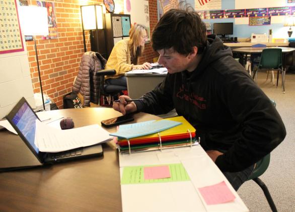 Owen Thorberg works on the Bronco Brew bookkeeping in Mrs. Vinton’s math class.