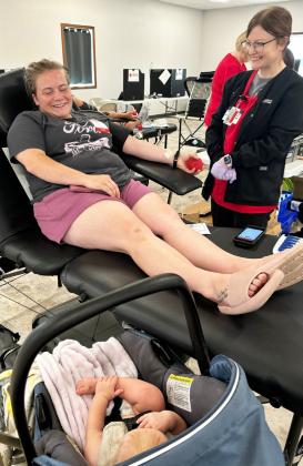 Axton Stichka was a very happy baby, talking up a storm while his mom, Shayna Stichka, donated blood.