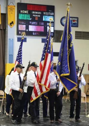 The American Legion and Auxiliary color guard retires the colors at the end of the Veterans Day program. Check out the Tribune’s Facebook page for more Veterans Day program photos.