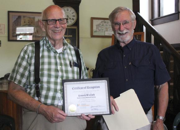 Nearly 70 people attended Ken Clark’s farewell reception at the Old Hotel last week the day before he left for his move to California. Among those was Bob Wickersham (right) from History Nebraska to present Ken with the Heritage Hero Award. Gerri Peterson