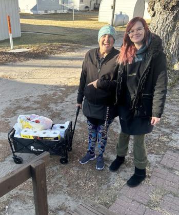 Rosemary Tracy submitted this photo of Mullen’s Macke’s Grocery employees Melanie Overmyer (left) and Mandi Stasch recently delivering groceries by wagon. “We are so fortunate to have such personal service,” Rosemary said. Rosemary Tracy