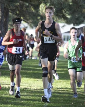 Top right: Alex Moore ran his first meet of the year last week after a knee injury last basketball season. Jill Coble