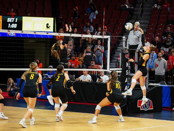 Brynne McCully goes up for a kill at state volleyball last Thursday, with Harper Andersen, Kalli Licking and Ella Rice covering. Megan Andersen