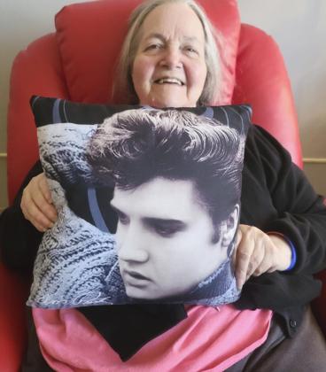 Ann Connell celebrating Elvis Presley’s birthday with her Elvis pillow.