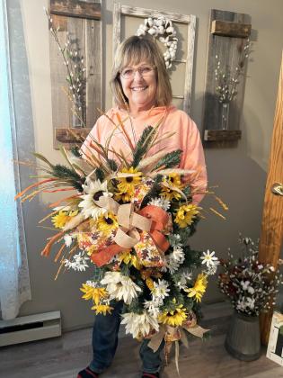 Teresa Hampton with one of the swags she has made. Gerri Peterson