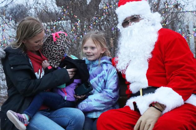 Wrenley Call wouldn’t even look at Santa, she just hid her face in mom Tara’s shirt, while sister Brystol was all smiles.
