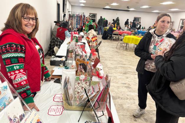 Teresa Hampton at her vendor table at the community center.