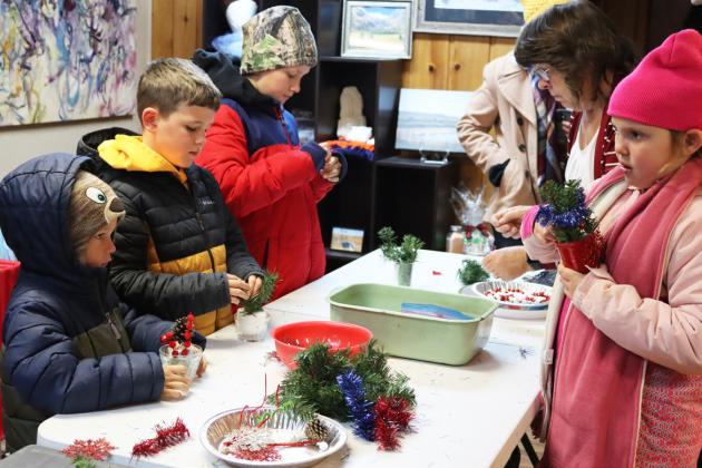 The Mullen Arts Center was a popular stop for a festive craft - Johnny, Tate and Cooper Phillips are pictured with Twila Phillips and Aislynn Connealy.