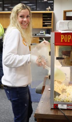 Dayspring Bank employee Wynn Cannon spotted the Tribune camera while she was bagging popcorn for the bank’s popcorn bar.