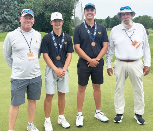 L-r: MHS Assistant Golf Coach Clint Svoboda, Ben Werner, Jacob Walker and Head Golf Coach Mike Brown at State Golf last week. Dominique Werner
