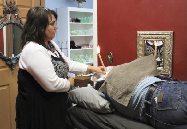 Ear candling is just one of the services offered at Cosmo Care. Gerri Peterson