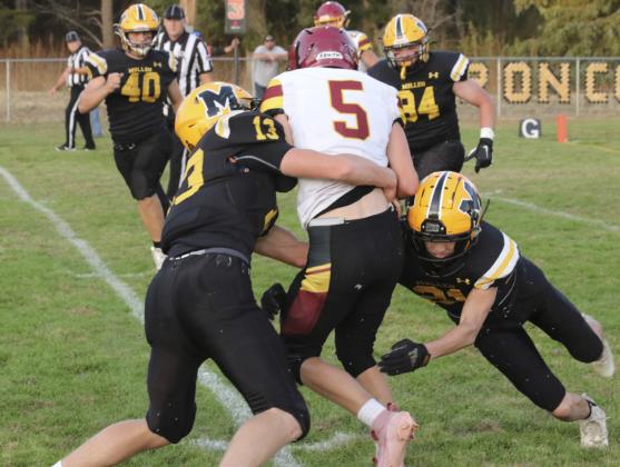 Chase Gracey and Cayden Hampton take down a Warrior last Friday. Carolee Brown
