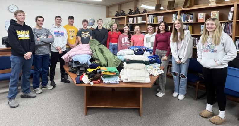 Mullen High School’s National Honor Society students traveled to Omaha this past weekend on a service trip. The community first donated to the NHS Winter Warm Up Drive, where 39 coats, 27 blankets and numerous pairs of gloves and hats were collected. NHS students are pictured above with them, l-r: Jackson Vinton, Jason Kraus, Cayden Hampton, Tate Kvanvig, Brandon Hardin, Alex Werner, Harper Andersen, Kalli Licking, Riley Hegland, Ella Rice, Ady Hampton, Sydnee Cheever, Hayley Donohoe. Kara Connealy