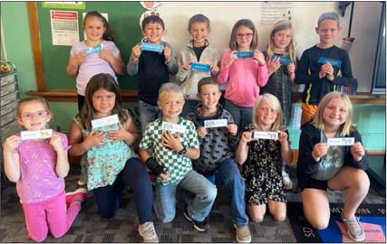 A big thank you to Cathy Nichols for making bookmarks for the elementary students! The second graders are pictured with their personalized bookmarks. Pictured back, l-r: Kaleah Heaton, Marcus Lattin, Grady Phipps, Sadie Hoyt, Marki Finney, Eli Barnes. Front: Anna Hessin, Zandra Hebbert, Killian Kearns, Holt Morrison, Daryl Deibler, Tatum Deibler. Emily Brown