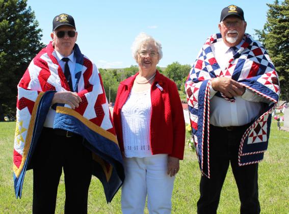 Seamstress Doris Starr with Quilt of Valor recipients Ted Bonesteel (left) and Chuck Anders.
