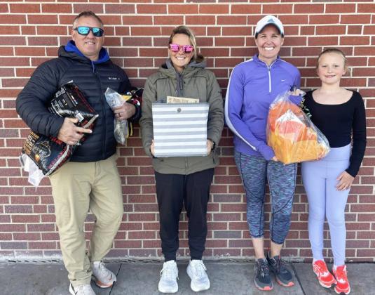 5K prize winners pictured l-r: Kyle and Ashley Hegland were the first walkers to come in and Gerri and Danielle Peterson received first place, with Gerri running and Danielle biking.