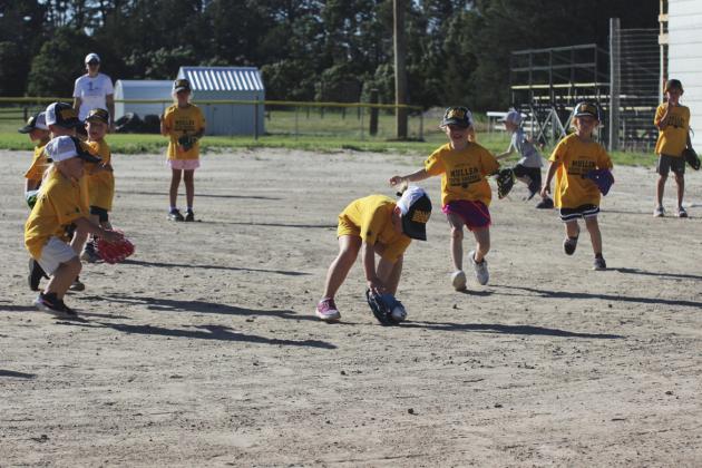 Harper Myers fields the ball during the t-ball game against Thedford on Monday, June 19, Dane Peterson