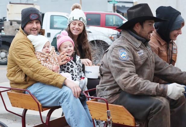 Jason, Lauren, Jordyn and Quinn Cheney were the first to go on the pony wagon ride downtown.