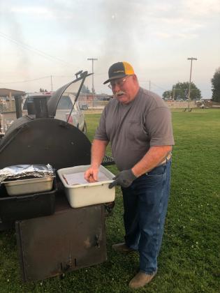 Pat Wright grills burgers at the MOB tailgate this year. Barb McIntosh
