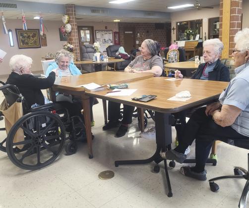 L-r: Kathleen Miles, Florence Cooper, Ann Connell, Wanda Mackley and Nadene Andersen playing Pass the Pig.