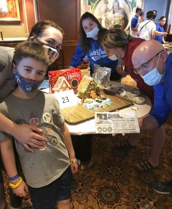More pictures from the front page Christmas cruise. Josh, Kelly, Kennedy, Emerson and Josh Tatge in the gingerbread house building contest on the cruise.