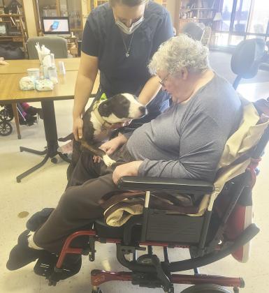 Marci Roman with Twila Springer. Pepper the puppy was here for a visit!