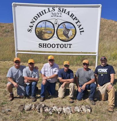 Grouse hunt 2nd place Past Shooters team - Shifty Shooters, with scorekeeper Brett Mauler (right).