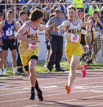 Alex Werner hands off to Chase Gracey in the 4x400 relay.