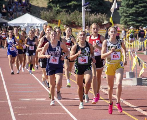 Peyton Paxton leads the pack during an exciting 1600, where she placed 2nd and broke the MHS school record.