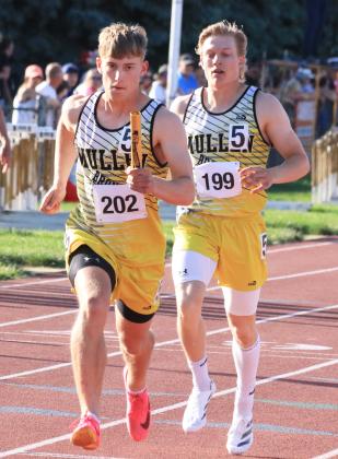 Alex Werner gets the hand off from Justin French in the 4x400 relay.