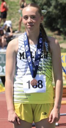 Harper Andersen on the medal stand for her 7th place finish in the 800.