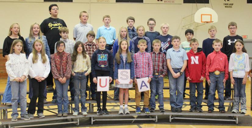 The fourth and fifth graders sang “Thankful for the USA” and “God Bless the USA.” Pictured back, l-r: Hunter Gray, Caleb Deibler, Duke Miller, Brantley Mertz, Samuel Hessin. Middle: Emri Dent, Ella Walz, Tuff Pettit, Jaxyn Evans, Ayden Lee, Kendall Phipps, Jedd Kraus, Lorenzo Gonzalez, Gus Wingebach, Cylas Dent. Front: Abbigail Mundorf, Avery Vinton, Natalee Walker, Finley Mundorf, Elle Gracey, Lillian Ericksen, Cooper Phillips, Ryden Ourada, Zach Hicks, Luke Cox, Tripp Jewell, Keira Kearns.