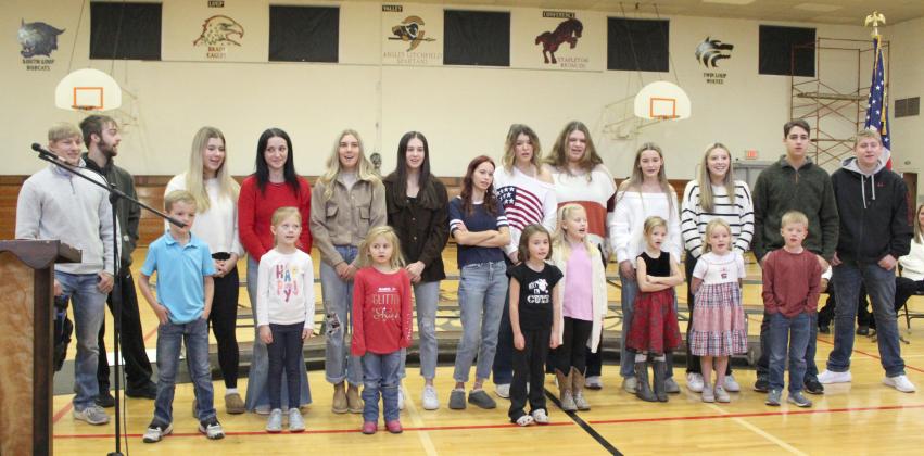 The MHS seniors and the kindergarteners sang “Oh Veterans” together at the Veterans Day program in Mullen on Monday. Pictured back, l-r: Justin French, Jacob Wingebach, Keragan Welch, Fayth Brown, Peyton Paxton, Allie Boyer, Brooke Williams, Medora DeNaeyer, Mia Flores-Green, Maggie Haesler, Izzy Hoyt, Jarren Forsen, Corben Kissire. Front: Cooper Peers, Brystol Call, Doris Boland, Addison Mundorf, Harper Myers, Ryhme Pettit, Ryann Walz, Finnegan Connealy.