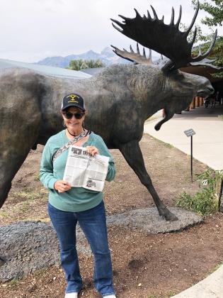Terry Fisher took the Tribune to Yellowstone National Park in September. She is pictured with the Grand Tetons.
