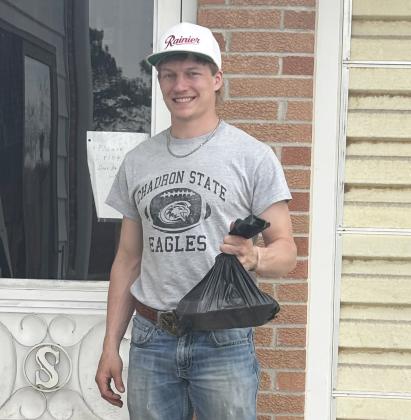 National Honor Society student Justin French, a MHS senior, prepares to deliver a meal last week.  Kara Connealy