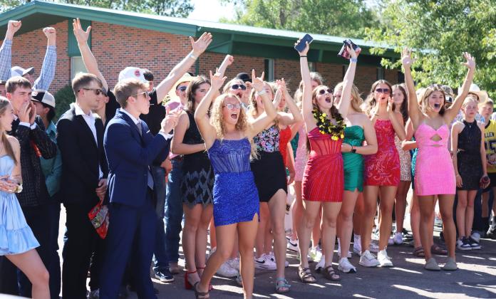 The junior class reacts to being named the Homecoming parade golf cart float winner!
