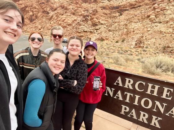 Ashlyn Simonson said she made time for her favorite newspaper on her spring break road trip with college friends! L-r: Stacey Petty, Rachel Dryden, Haylea Cummings, Eva Weiss, Hannah Cummings and Ashlyn at Arches National Park.