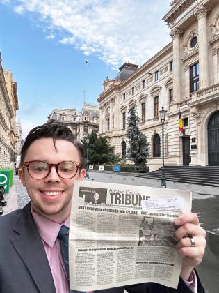 One of the Tribune’s newest subscribers, Max Zitek of Lincoln, embraced the Vacationer Issue and took the Tribune with him on a work trip to Bucharest, Romania. He is in front of the National Bank of Romania.