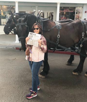 Terry Fisher on Mackinac Island in Michigan with her buddies Harvey and Cooper.