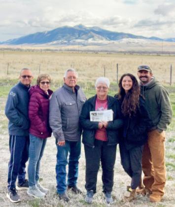 The Boyers and Spurlins took the Tribune with them when they visited Jarod and Lexi in Montana. Pictured l-r: Tony and Starla Spurlin, Willard and Betty Boyer and Lexi and Jarod Spurlin.