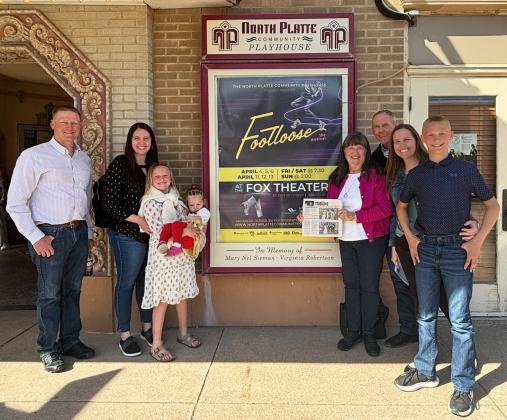 Your trip doesn’t have to be far to take the Tribune with you! The Tribune saw Footloose at the North Platte Community Playhouse with this family group in April. Pictured l-r: Dane Peterson, Jincy Ross, Danielle Peterson holding Stella Ross, Shirley and Dan Osborn and Gerri and Teal Peterson.