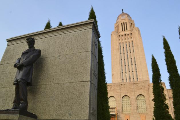 A host of Taylor Juniper trees surround the Lincoln Monument on the west side of the Nebraska Capitol Building.