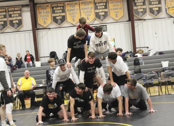 The wrestling team killed time between duals by building a pyramid!