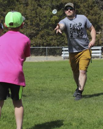 The Mullen Elementary enjoyed a fun and hot Field Day last Thursday, May 4th. Students competed in personal events like high jump, long jump, rope skip, shoe kick, softball throw and races. Students also competed on colored teams playing a variety of fun games like a shoe pile relay, pass the hula hoop, a baton relay, a three-legged race and a water balloon toss. Pictured is Elementary Principal Brett Mauler participating in the water balloon toss with his partner, Tripp Jewell. Gerri Peterson