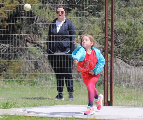 Eve Ericksen competing in the softball throw.