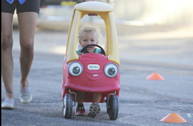 Burke Mundorf had a little help from his mom to power through the bicycle rodeo weave last Monday evening. Gerri Peterson