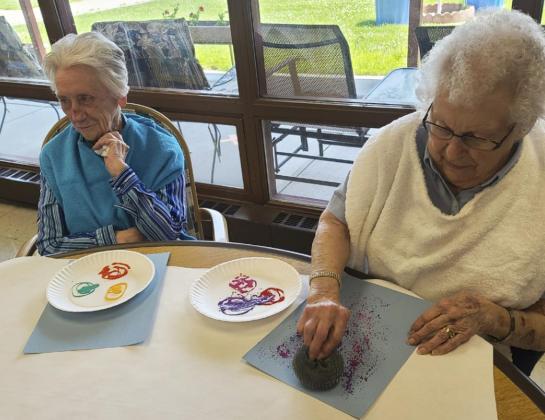 Wanda Mackley (left) and Nadene Andersen during arts and crafts.